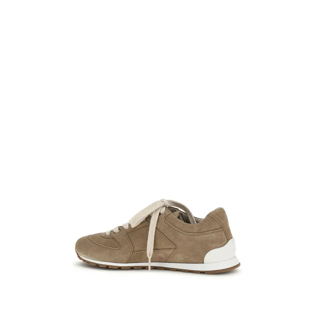Brunello Cucinelli beige suede low-top sneaker with cream laces, rounded toe, and white rubber sole.