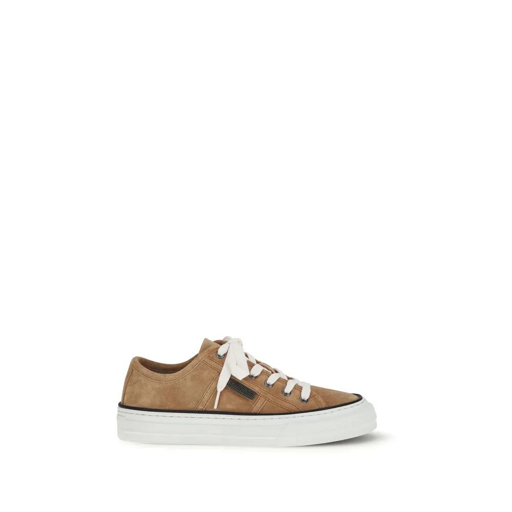 Brunello Cucinelli beige suede low-top sneaker with white laces, black sole stripe, and thick white rubber sole.