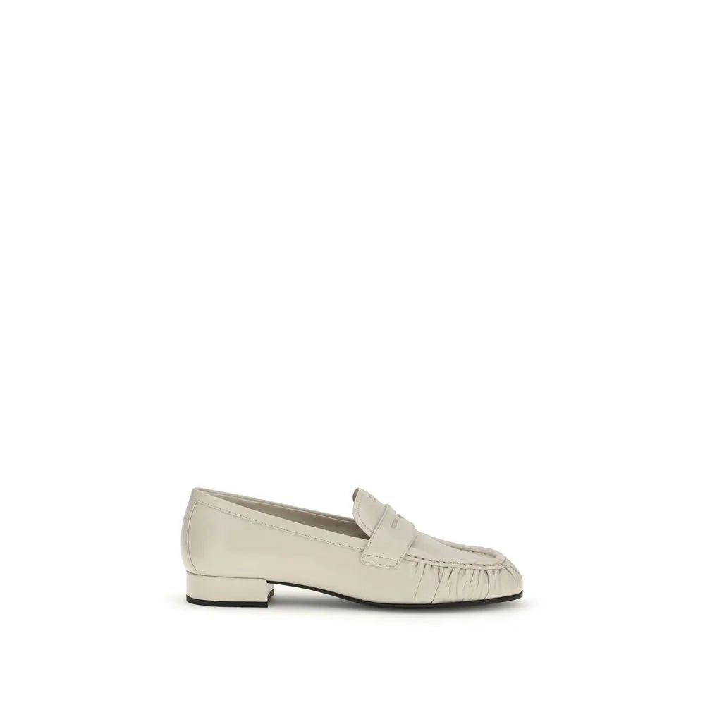 Beige calf leather slip-on loafers with a ruched toe, penny strap, and low block heel.