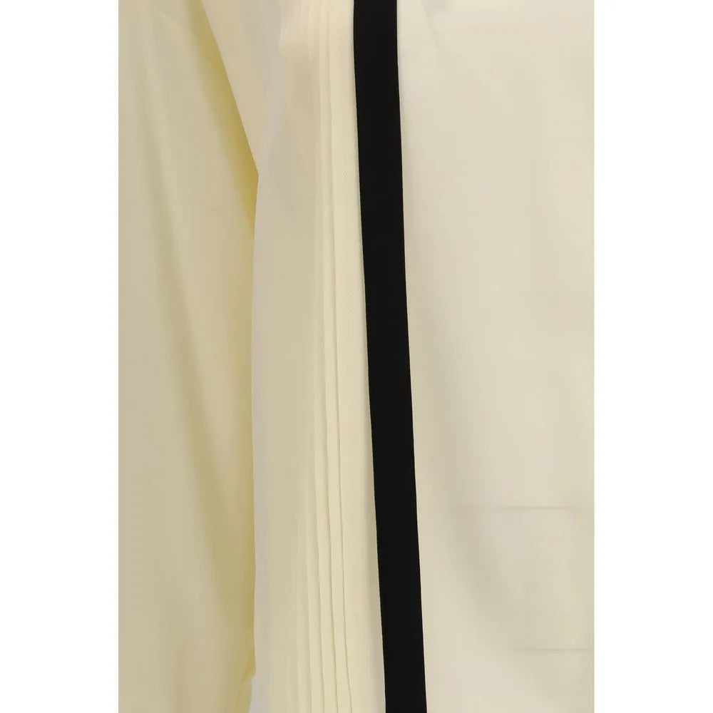 Ivory pure silk blouse with a prominent black vertical trim and tailored front pintuck details.
