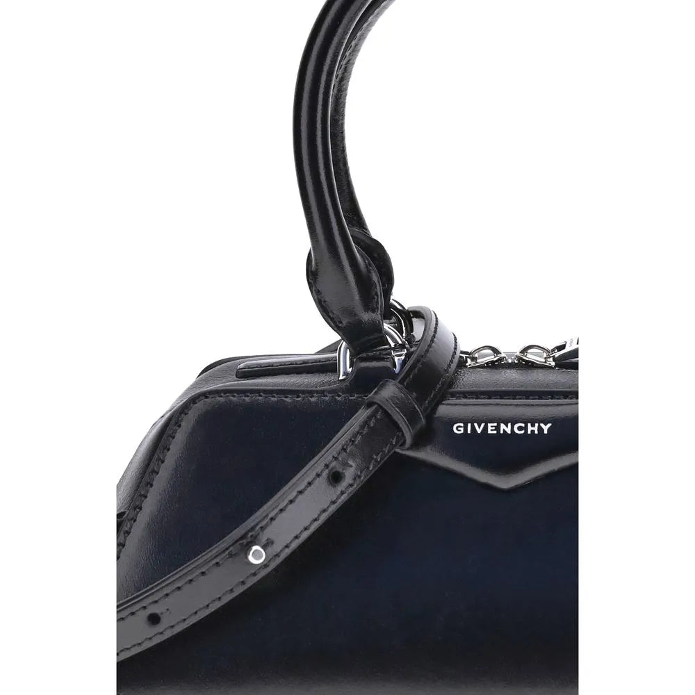 Black calf leather Givenchy Antigona East-West Mini handbag with structured design, top handle, shoulder strap, and silver hardware.
