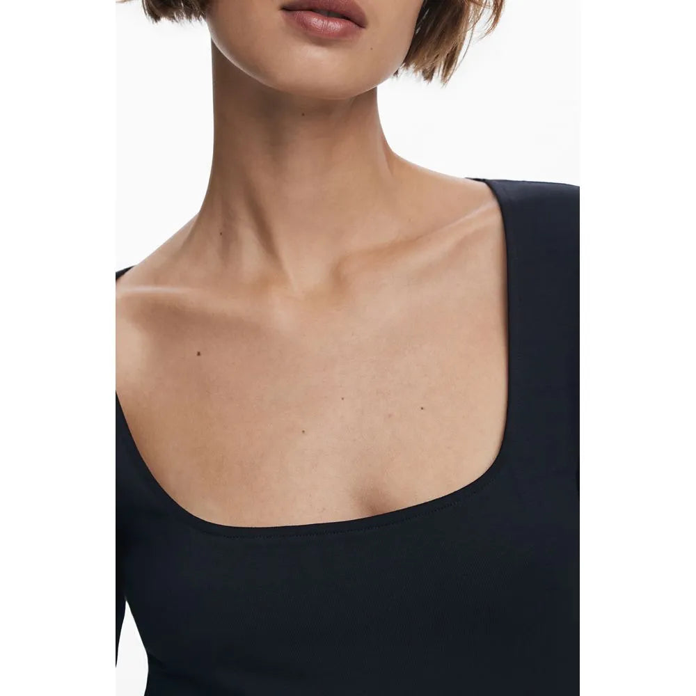 Black cotton blend women's dress featuring a generous square neckline and smooth fabric.