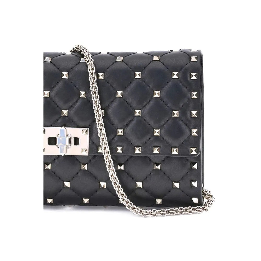 Valentino Garavani black lambskin quilted shoulder bag with silver Rockstuds, chain, and turnlock.