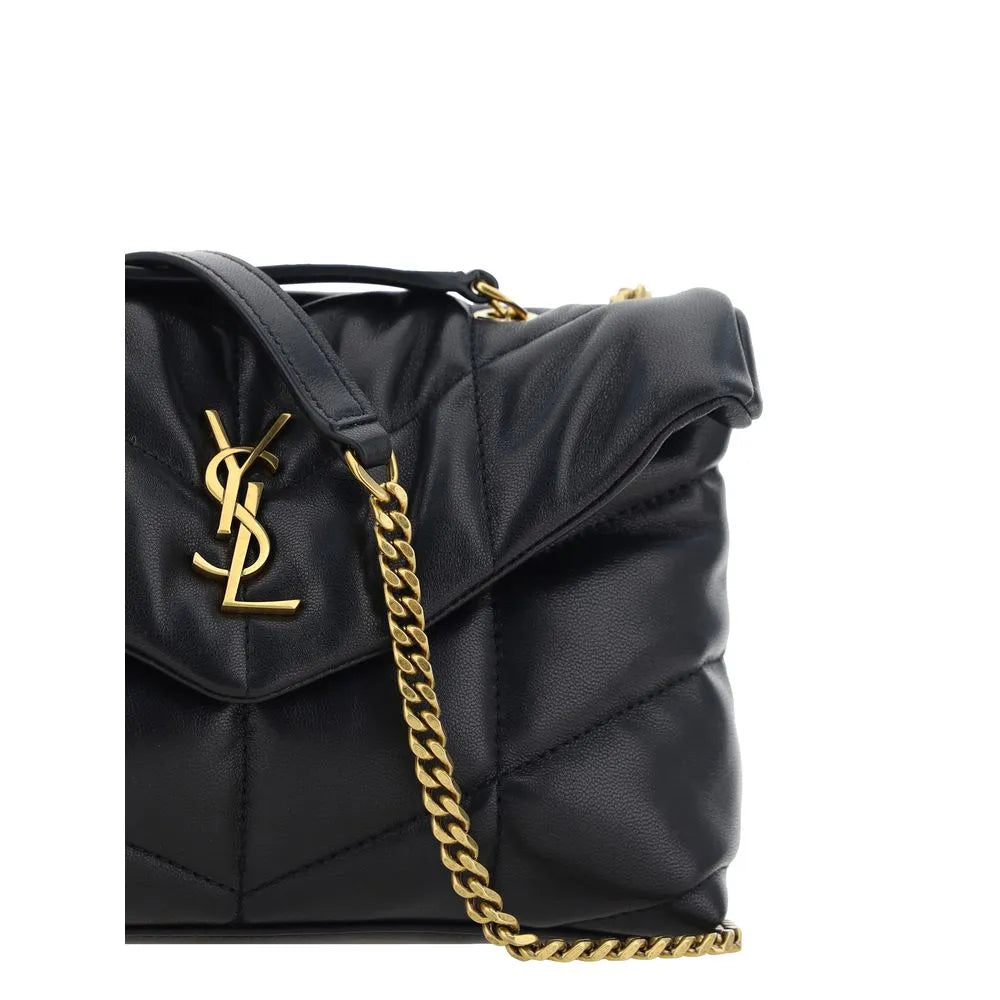 Black Saint Laurent Puffer Toy shoulder bag. Soft, padded lambskin with chévron quilting, gold YSL logo, and chain strap.