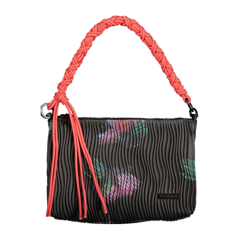 Black polyethylene handbag featuring a wavy texture, colorful floral pattern, and a bright coral braided handle with tassels.