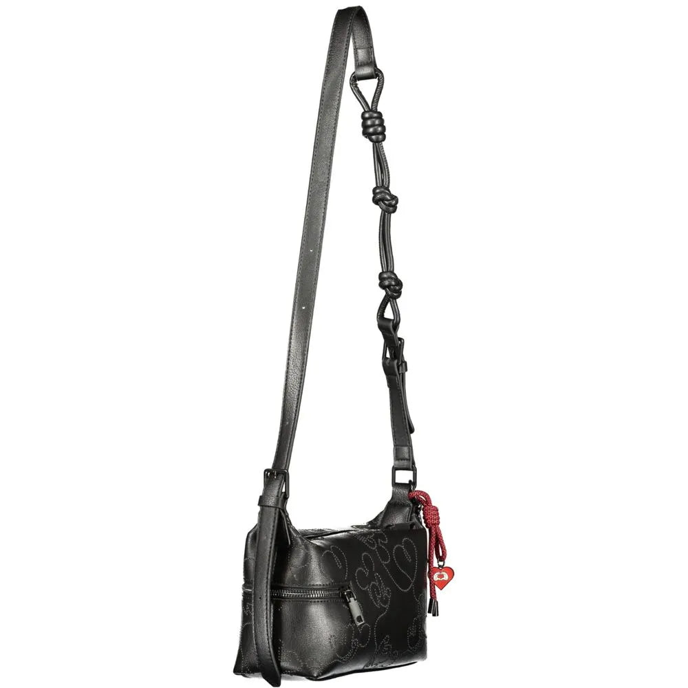 Black Desigual polyurethane women's crossbody bag with subtle heart patterns, knotted strap, and red heart charm.