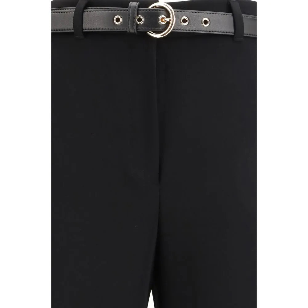 Black triacetate dress pants, high waist, with a black nappa leather belt and gold circular buckle.