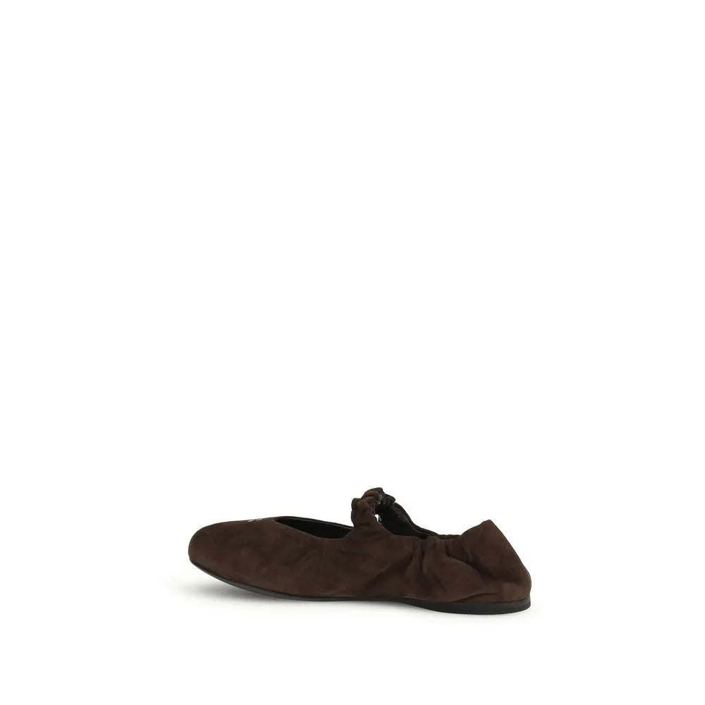 Brown suede ballet flats featuring a round toe, instep strap, and gathered elasticated heel.