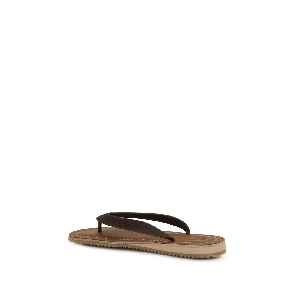 Brown calf leather flip-flop sandal with visible stitching, layered sole, and wavy rubber tread.