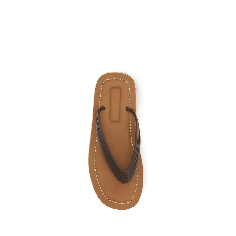 Miu Miu brown calf leather flip-flop sandal with dark brown rubber straps, white stitching, and brand logos.
