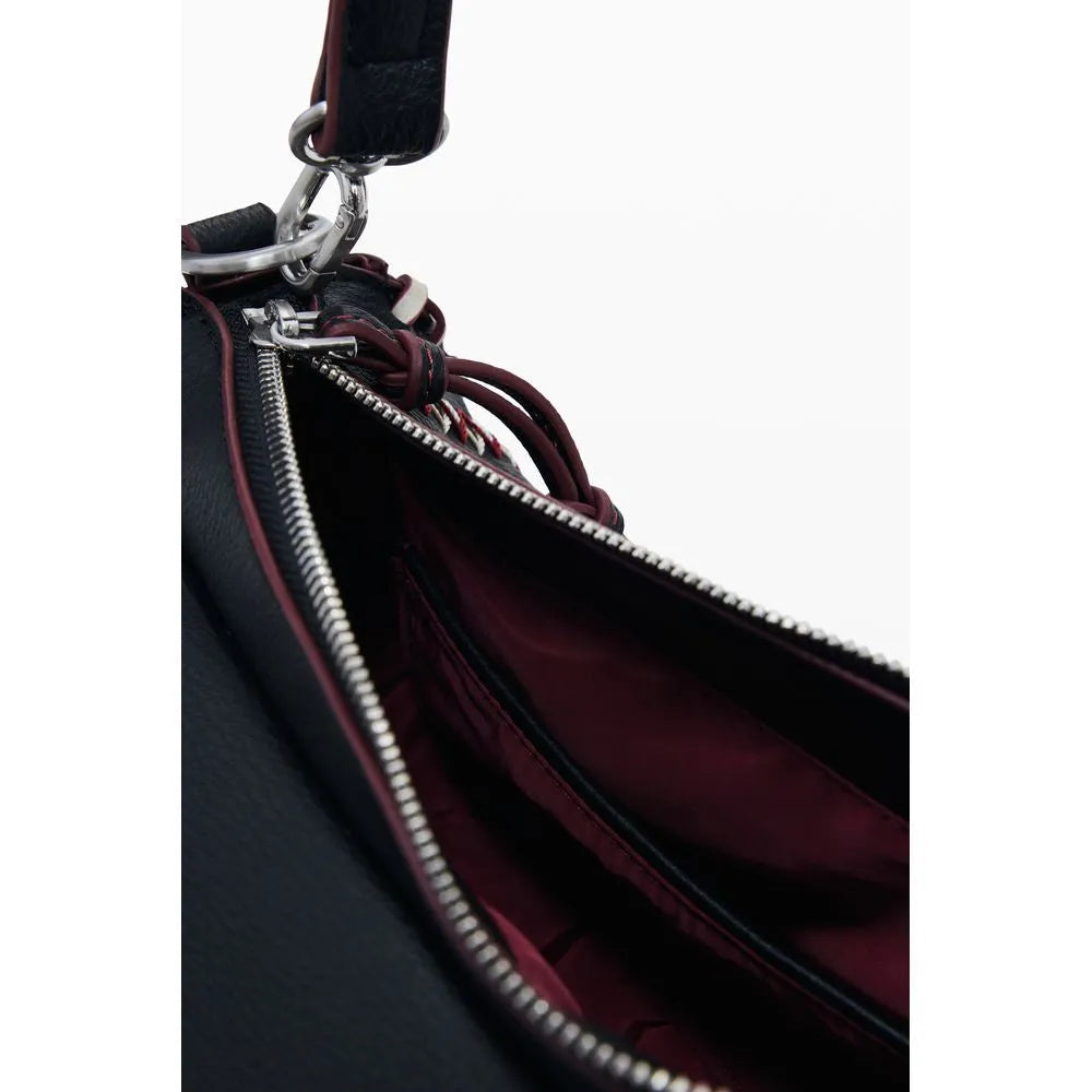 Nero poliuretano Desigual women's bag, open, showing silver zipper, dark red lining, and contrasting strap details.
