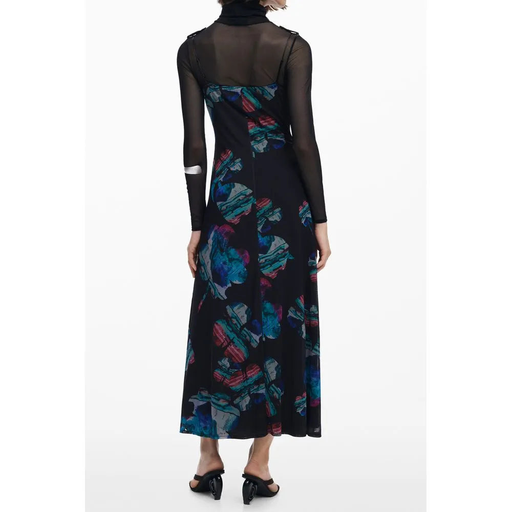 Black Desigual long dress with vibrant blue/pink watercolor pattern, layered over a sheer high-neck top.