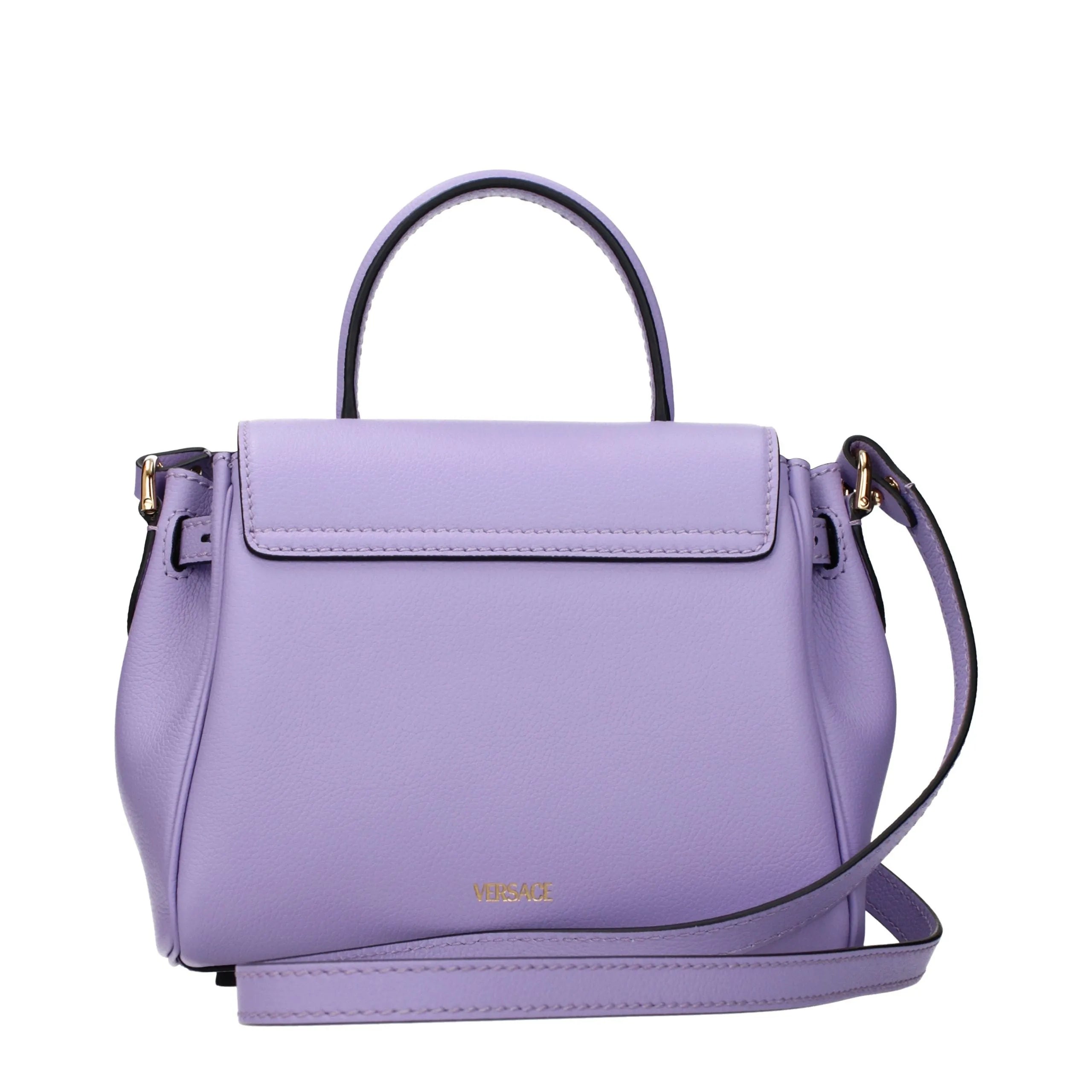 Versace lavender leather top-handle handbag with gold logo, flap closure, and adjustable shoulder strap.