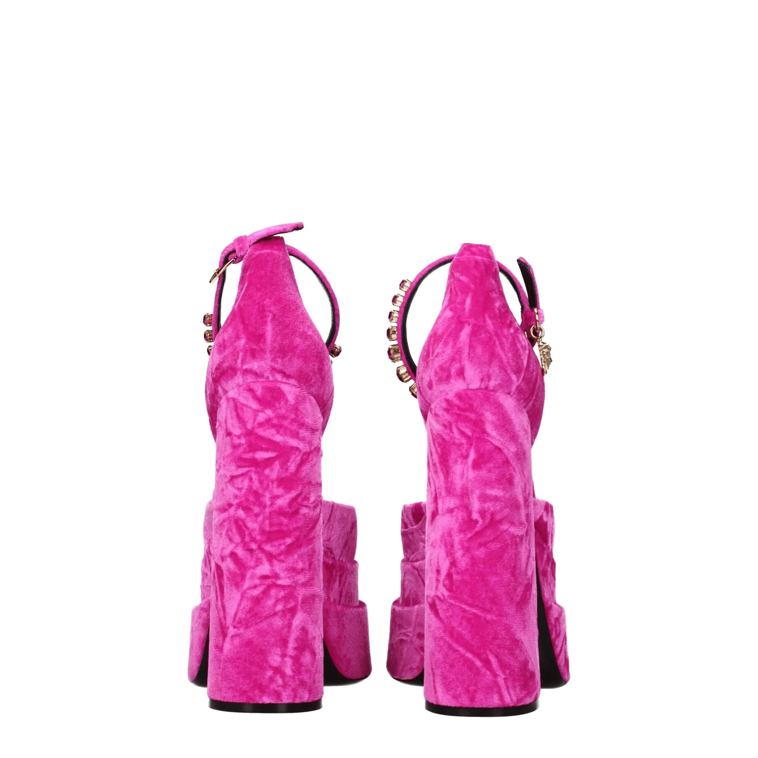 Versace fuchsia pink velvet platform sandals with rhinestone ankle straps and chunky heels.