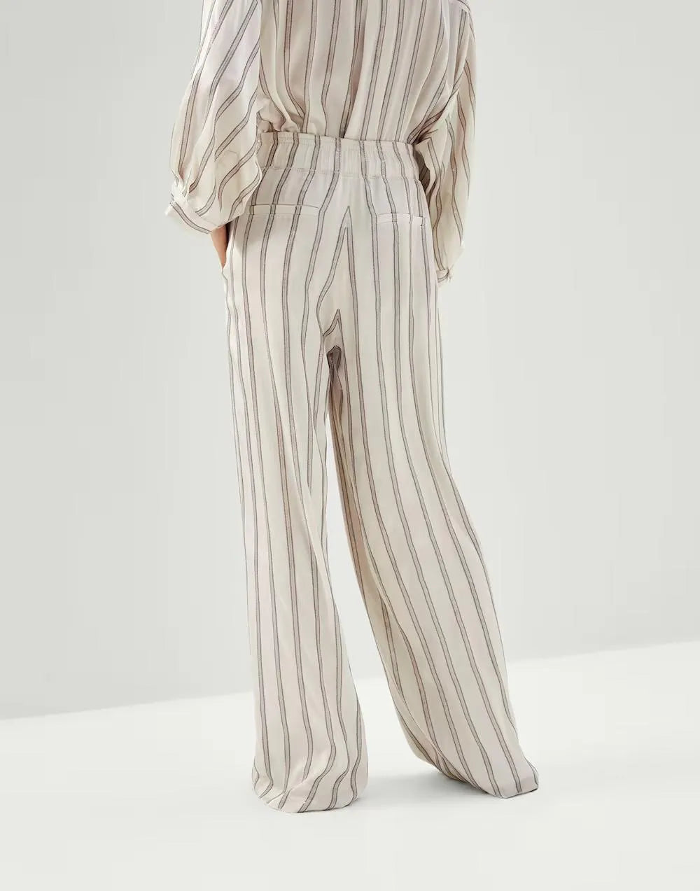 Warm white striped wide-leg women's acetate dress pants. Elegant, flowy design.