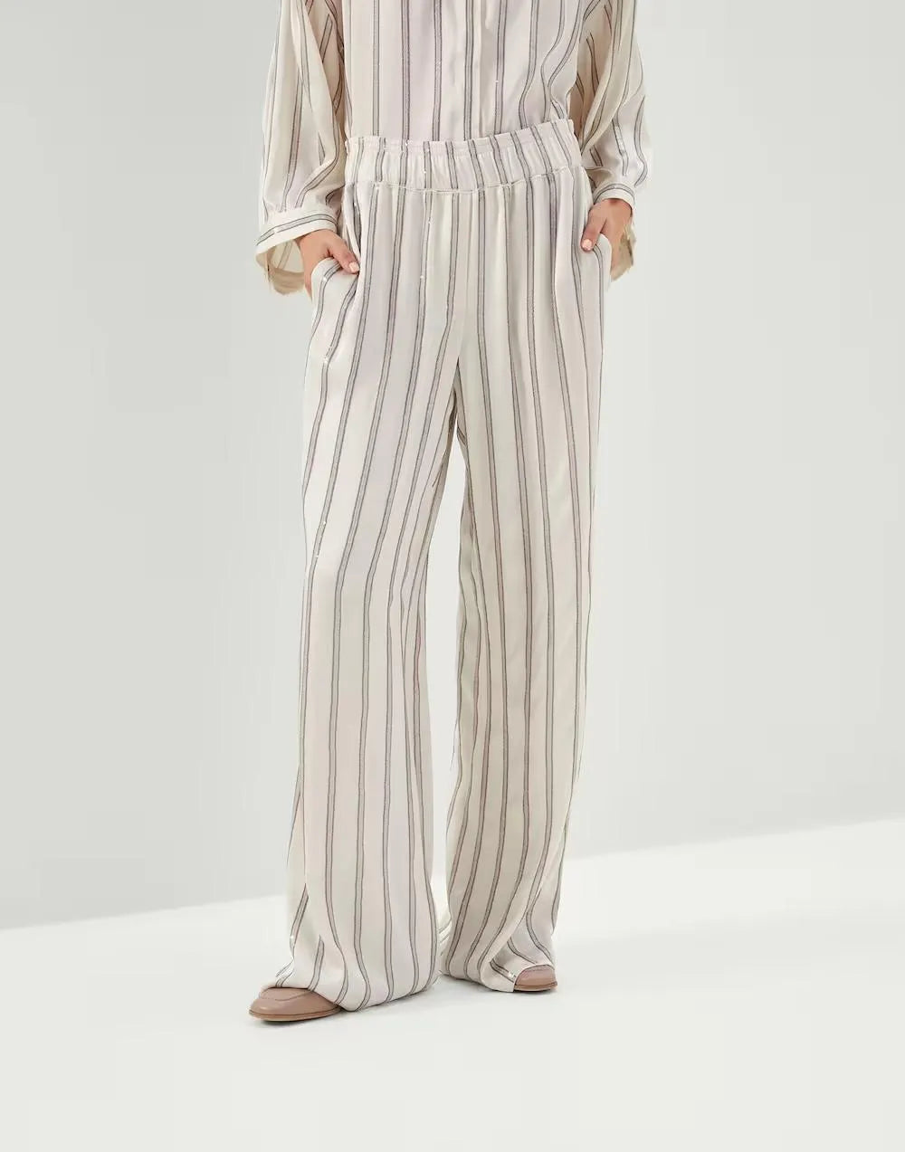 Brunello Cucinelli women's warm white acetate-silk wide-leg striped pants with side pockets.