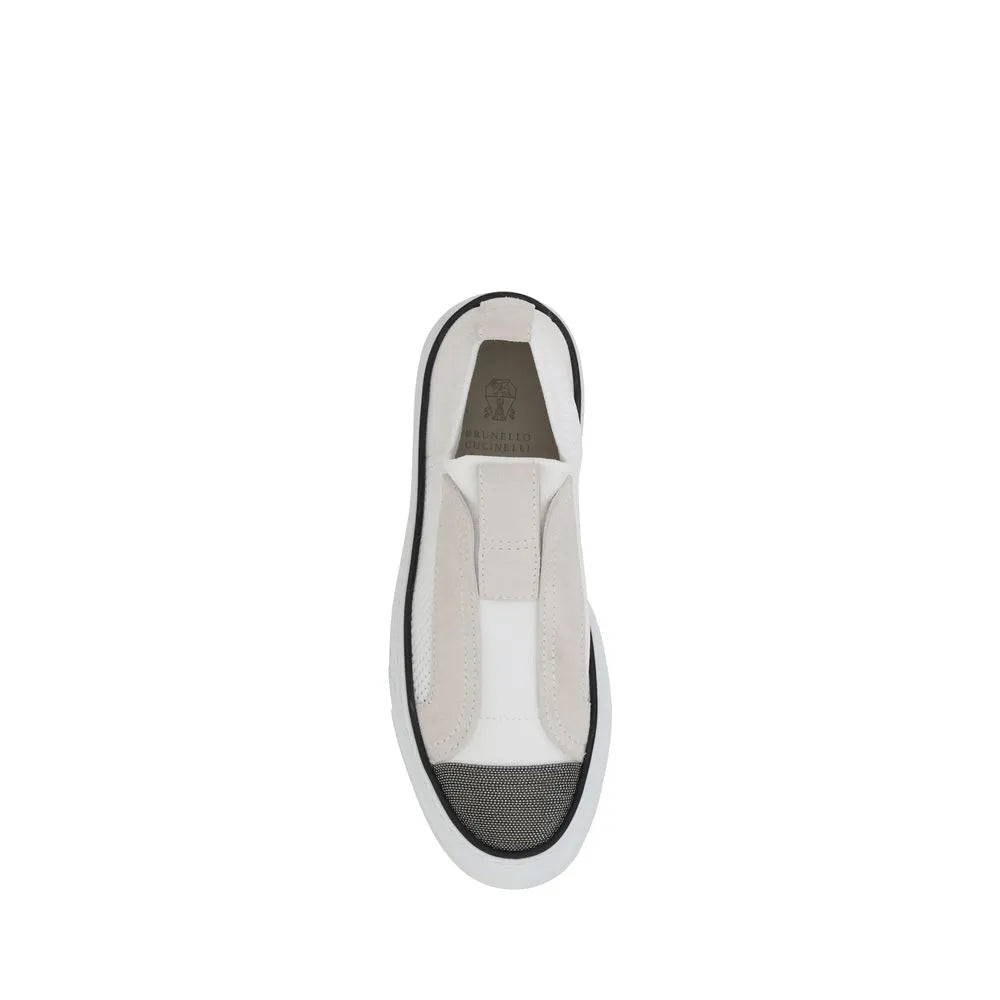 White Brunello Cucinelli low-top slip-on sneakers with nylon, grey suede panels, mesh, and textured toe.