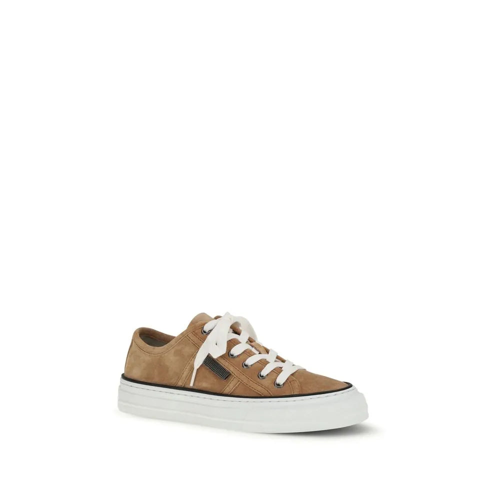 Beige calf leather suede low-top sneaker with white laces, thick white rubber sole, and black stripe.