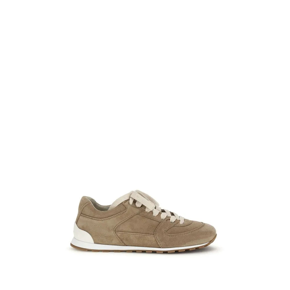 Beige suede calf leather low-top sneakers with rounded toe, white laces, stitched details, and rubber sole.