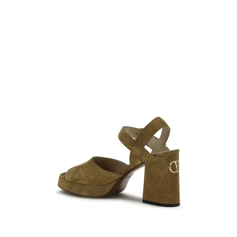 Valentino Garavani Fawcette olive suede platform sandals with VLogo on block heel and adjustable ankle strap.