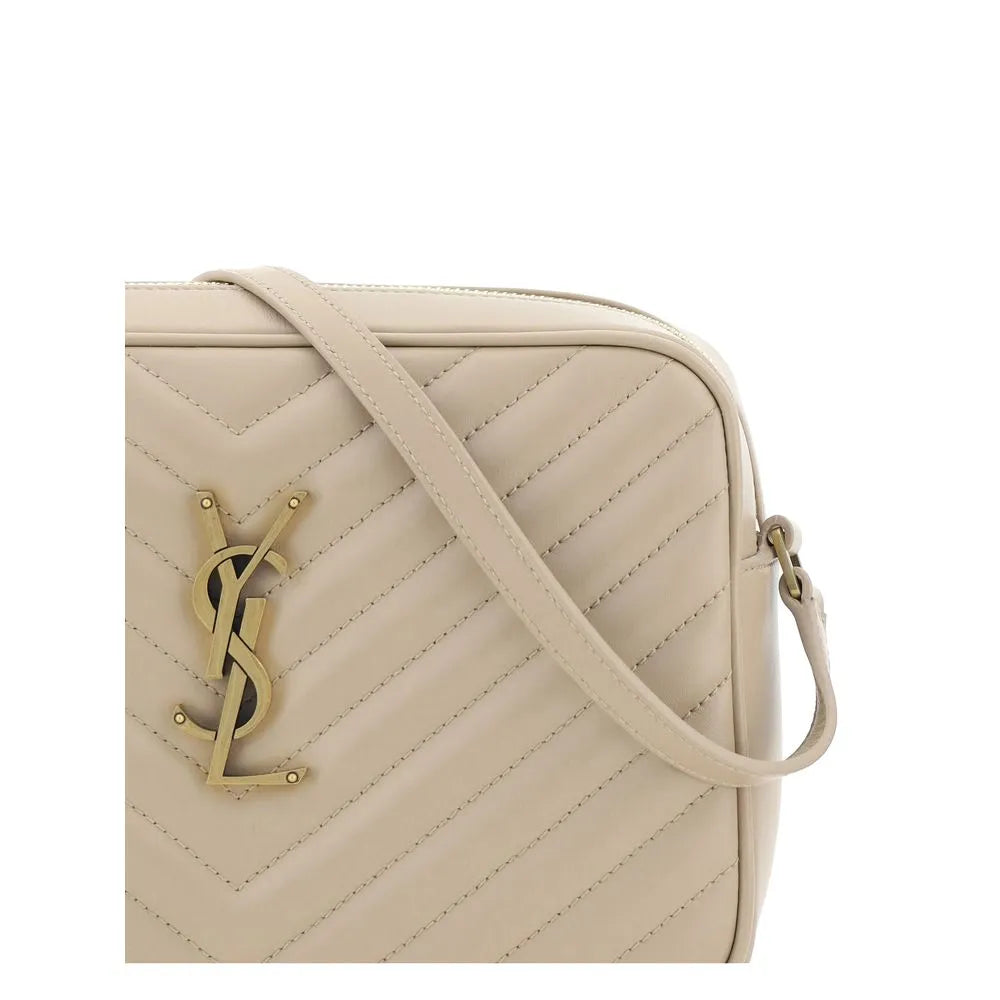 Beige calf leather Saint Laurent shoulder bag with chevron quilting, padded design, gold YSL logo, and flat strap.