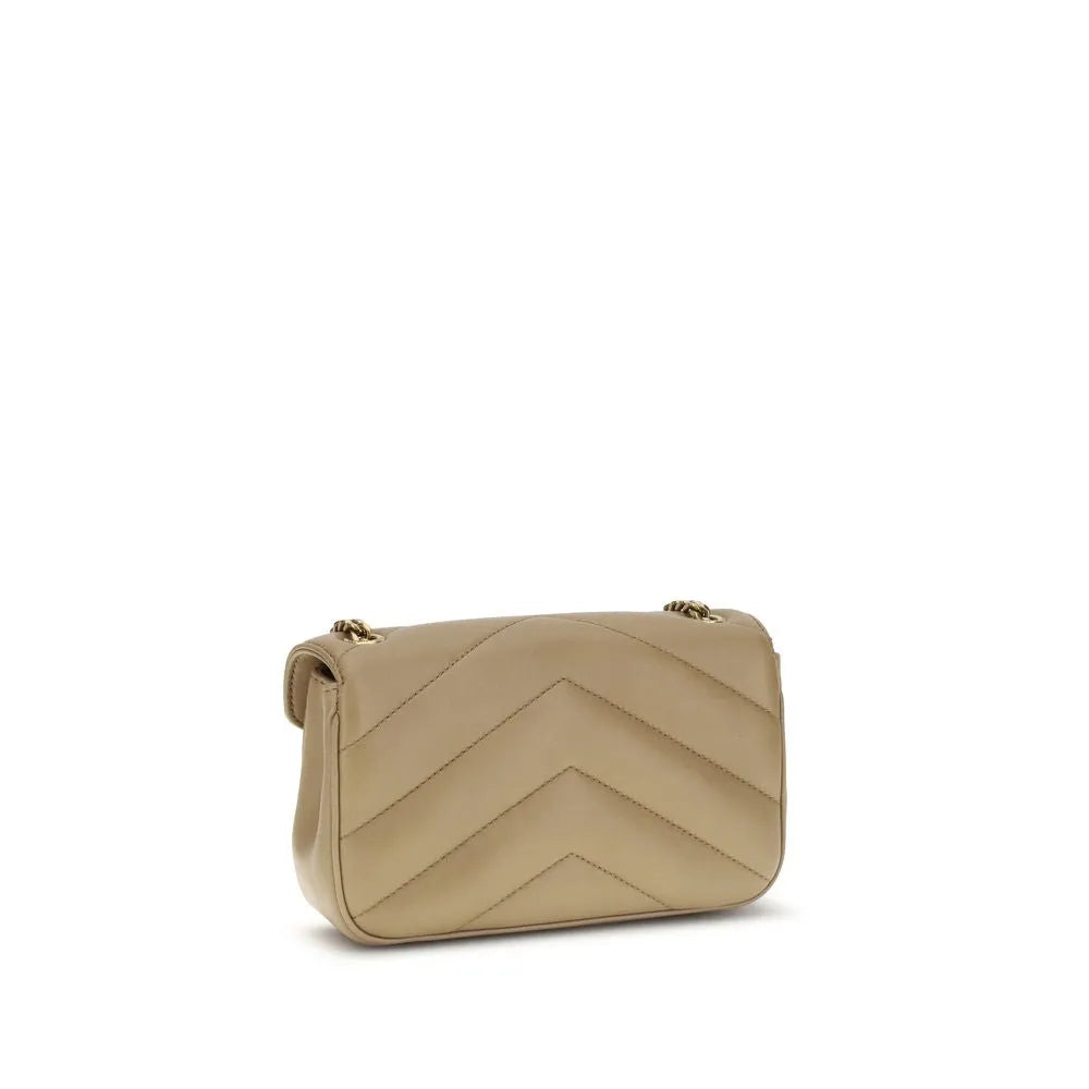 Beige lambskin shoulder bag with chevron quilting and gold chain strap.