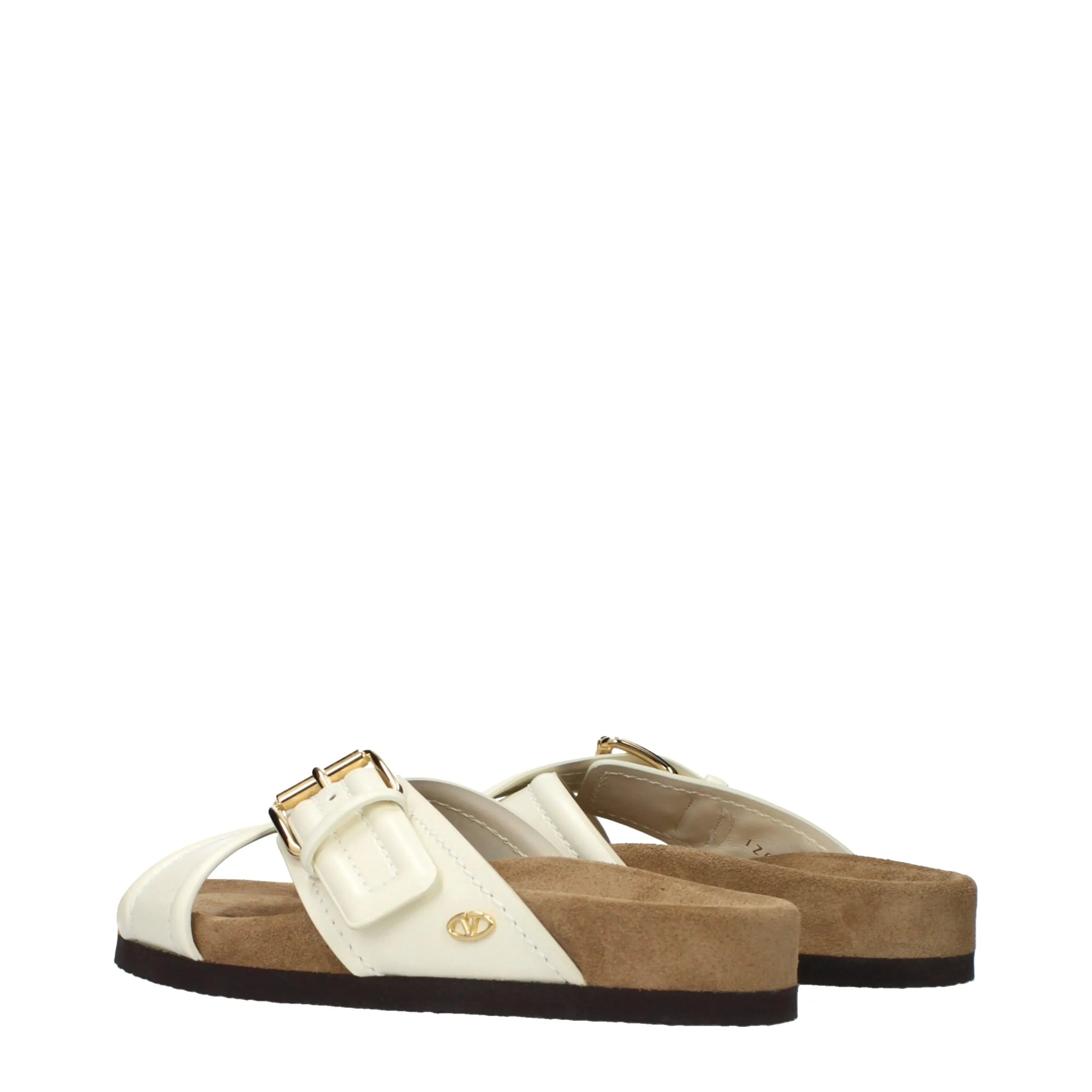 Valentino Garavani beige leather slippers with shiny straps, gold buckle, and V logo. Cork footbed.