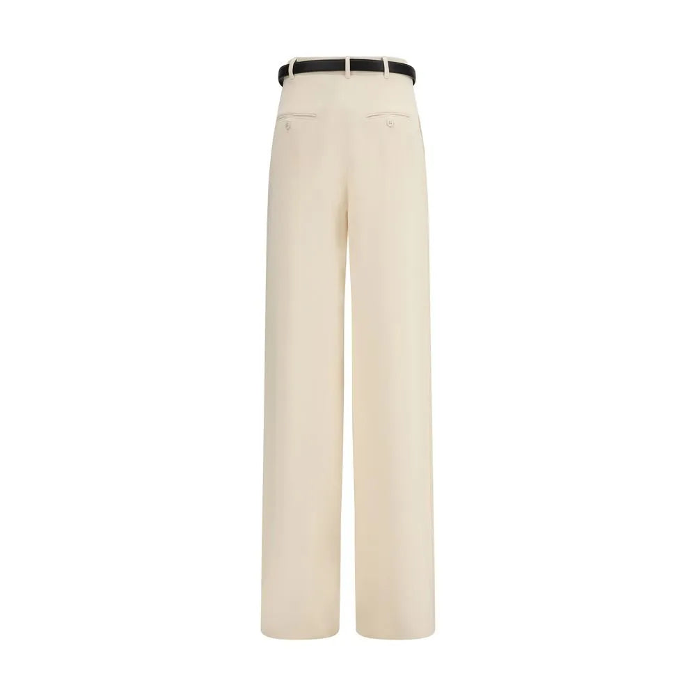 Luminous ivory wide-leg triacetate dress pants, high-waisted, with a black leather belt and rear button-welt pockets.