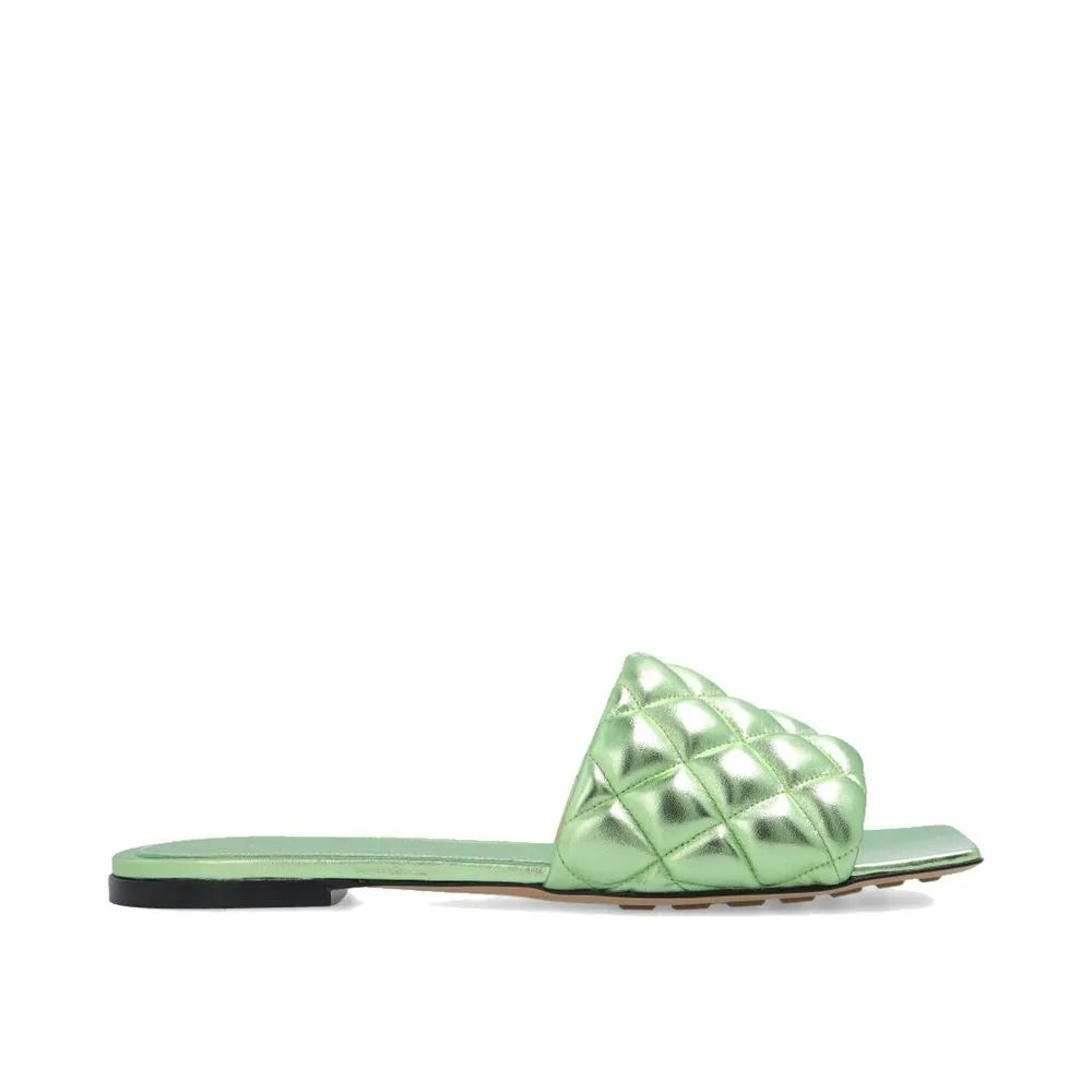 Metallic lime green quilted calfskin slide sandal with square toe and flat sole.