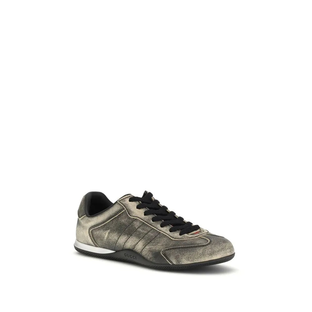 Gucci Shift low-top sneaker in black délavé-effect calf leather with red and green Web tab and two-tone rubber sole.