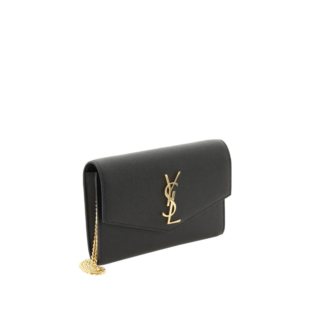 Black Saint Laurent calf leather wallet on chain with prominent gold YSL logo and gold-tone chain strap.