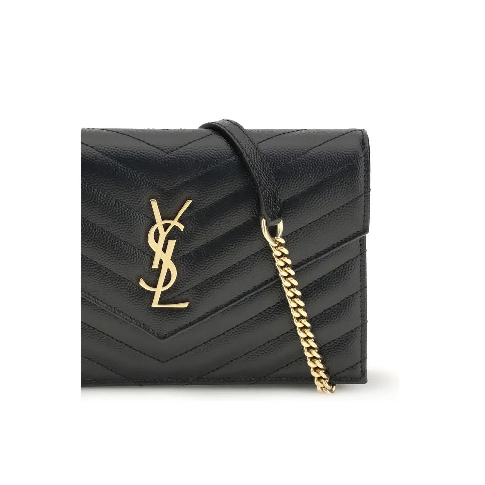 Black calf leather Saint Laurent Cassandre mini bag with chevron quilting, gold YSL logo, and chain strap.