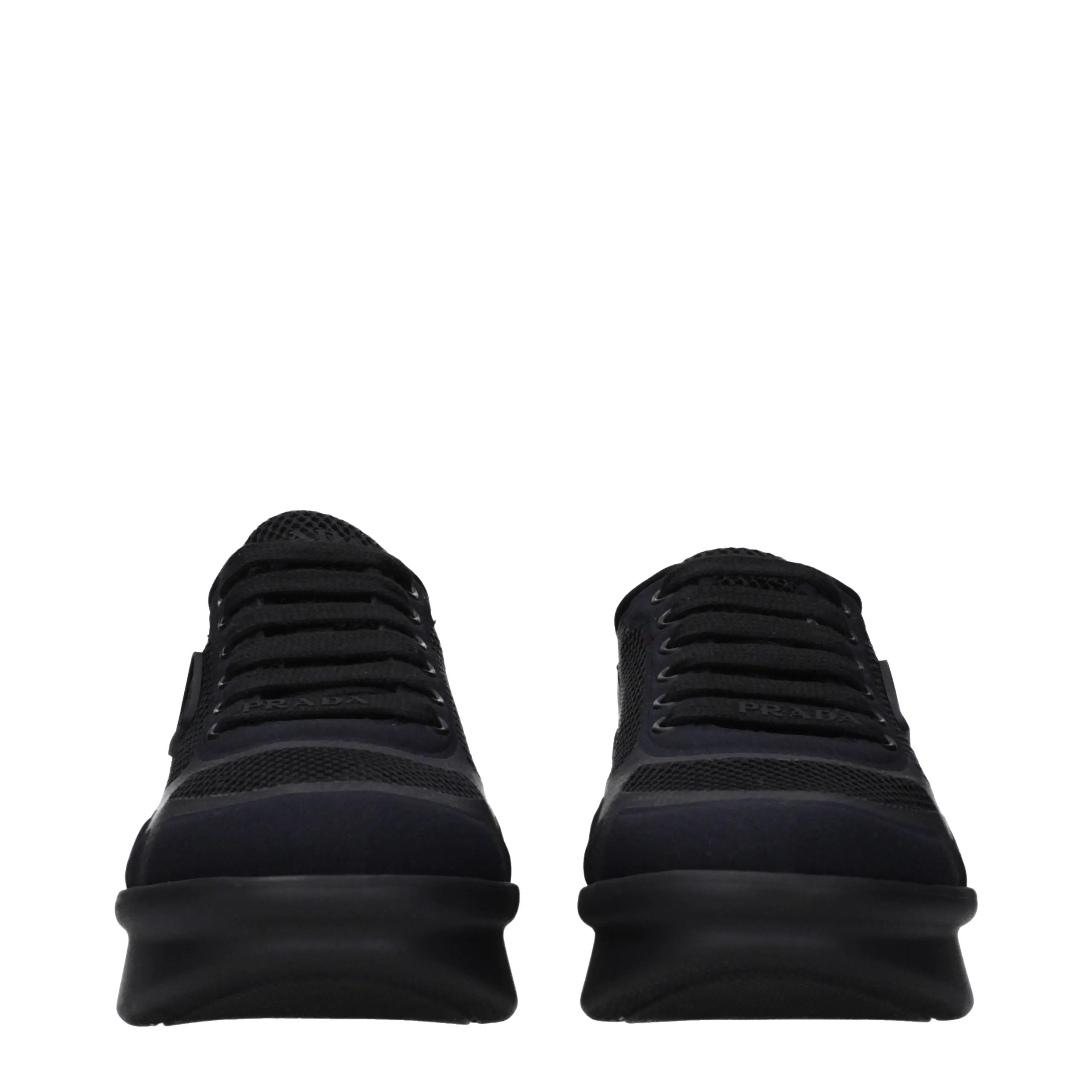Black Prada fabric low top sneakers with a textured upper, visible front logo, and thick black sole.