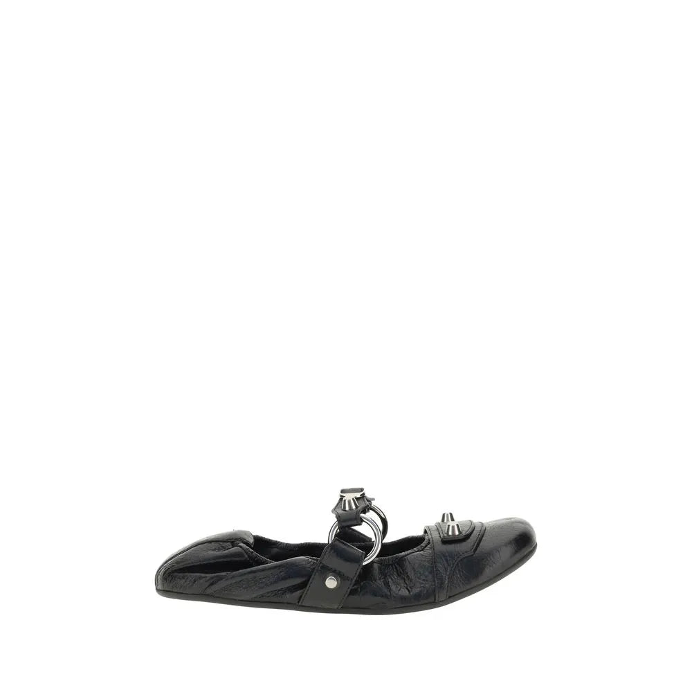 Black Balenciaga lambskin ballet flat with rounded toe, silver studs, ring strap, and elastic back.