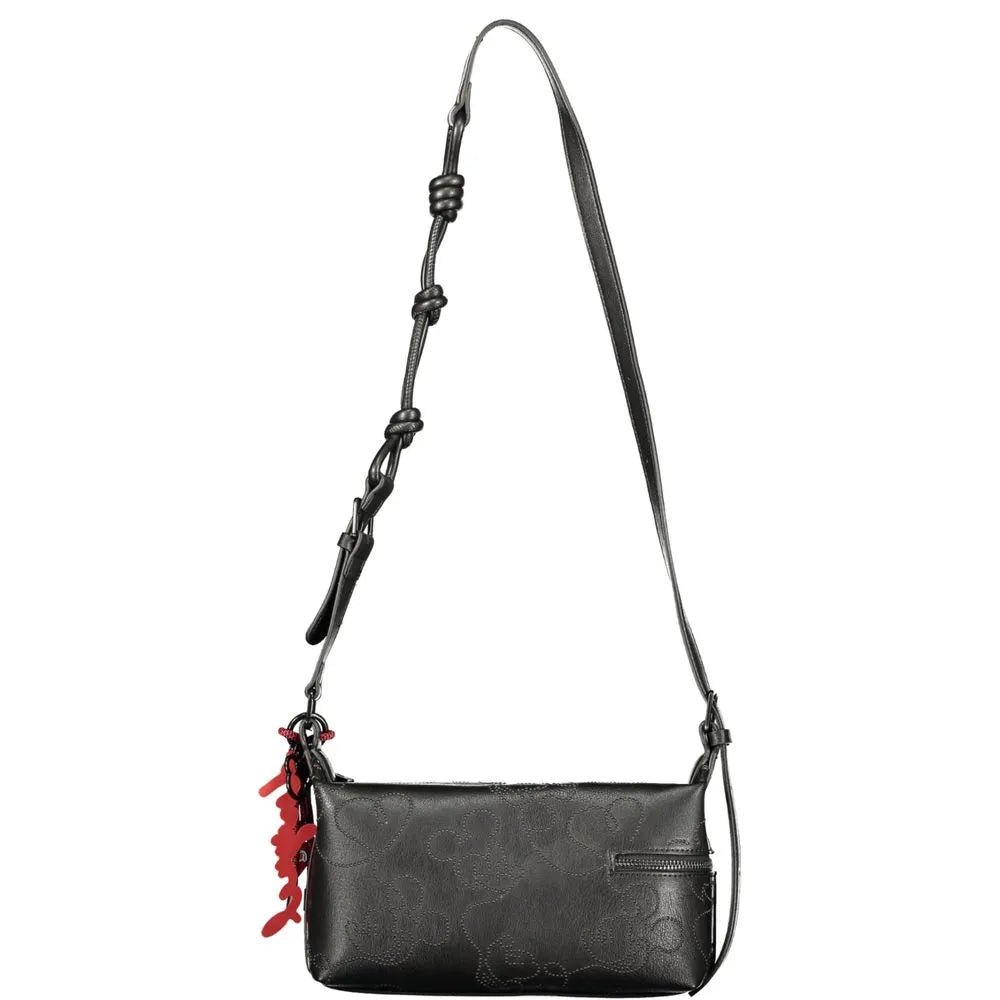 Black polyurethane Desigual women's handbag with embossed design, adjustable strap, side zip pocket, and red key ring.