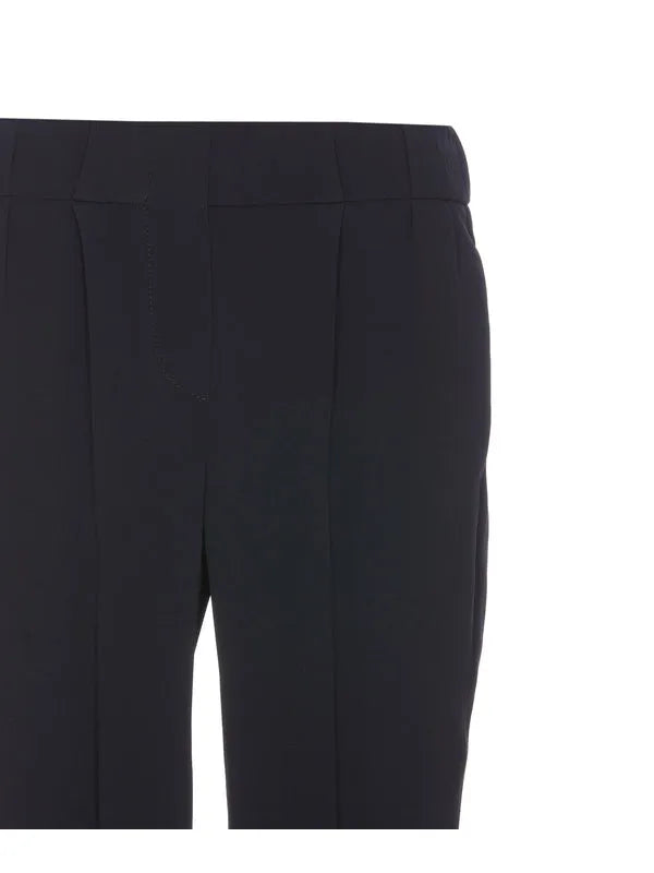 Brunello Cucinelli women's blue acetate-silk blend pants, showing tailored waist and vertical pleats.