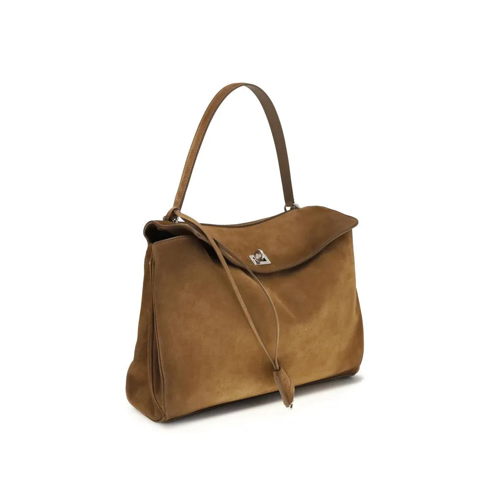Medium brown waxed suede calfskin shoulder bag with top handle, silver turn-lock closure, and leather tassel.