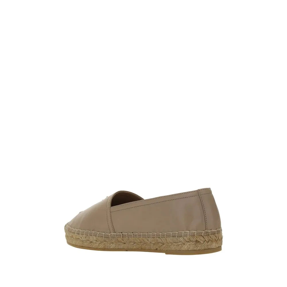 Brown lambskin slip-on espadrille with flat jute rope sole and subtle press-stamped YSL monogram.