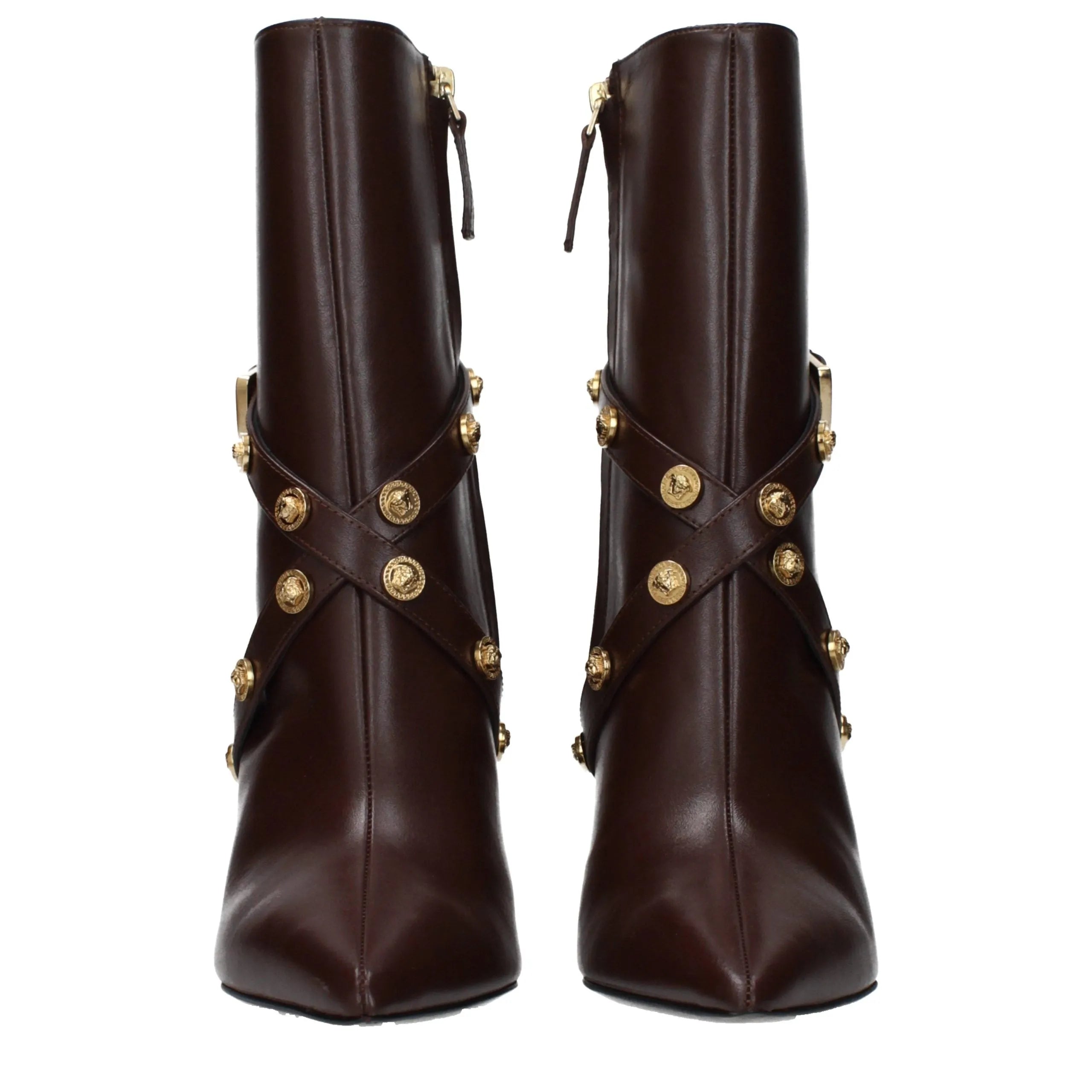 Versace chocolate leather ankle boots with pointy toe, high heel, and gold studded straps.