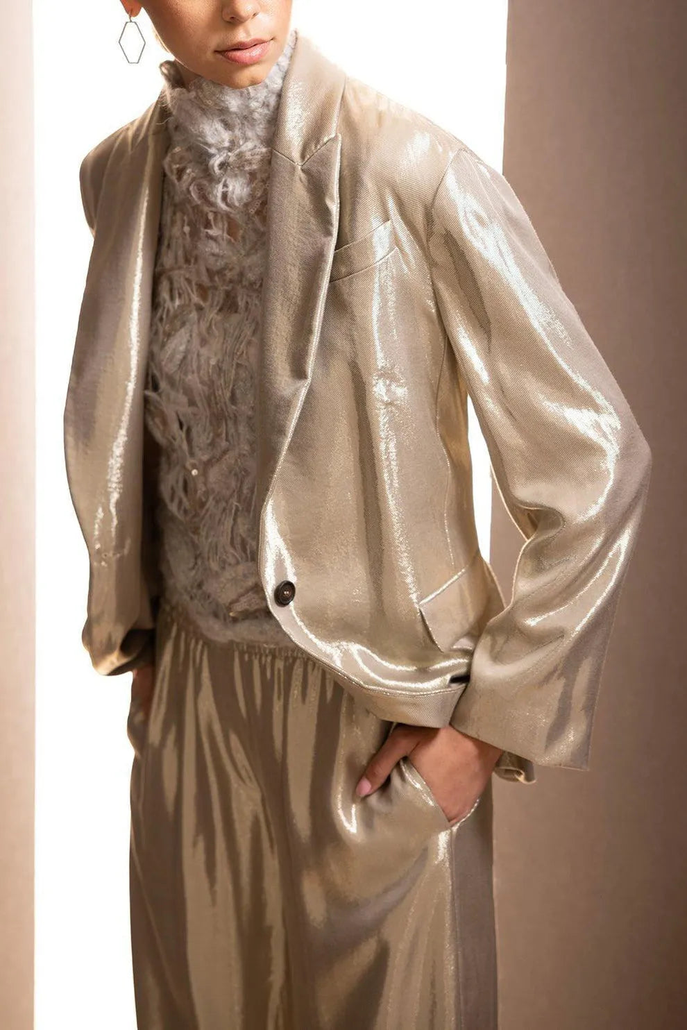 Lustrous gold viscose casual pants for women, featuring a relaxed fit and elegant shine.