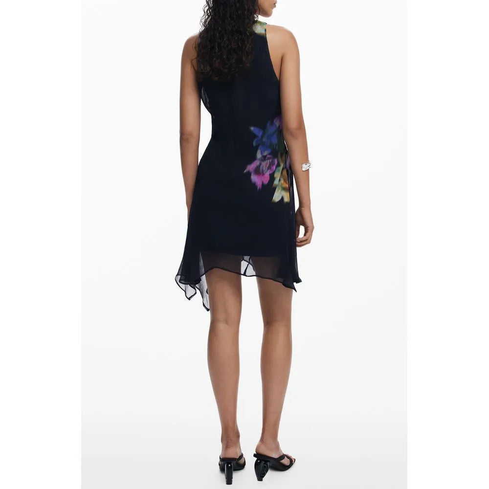 Nero Desigual Nala sleeveless polyester dress with vibrant floral print and sheer asymmetrical hem.
