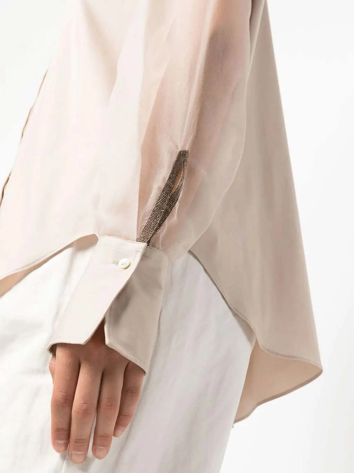 Brunello Cucinelli pink beige cotton blend blouse with translucent long sleeves and sparkling monili cuff detail.