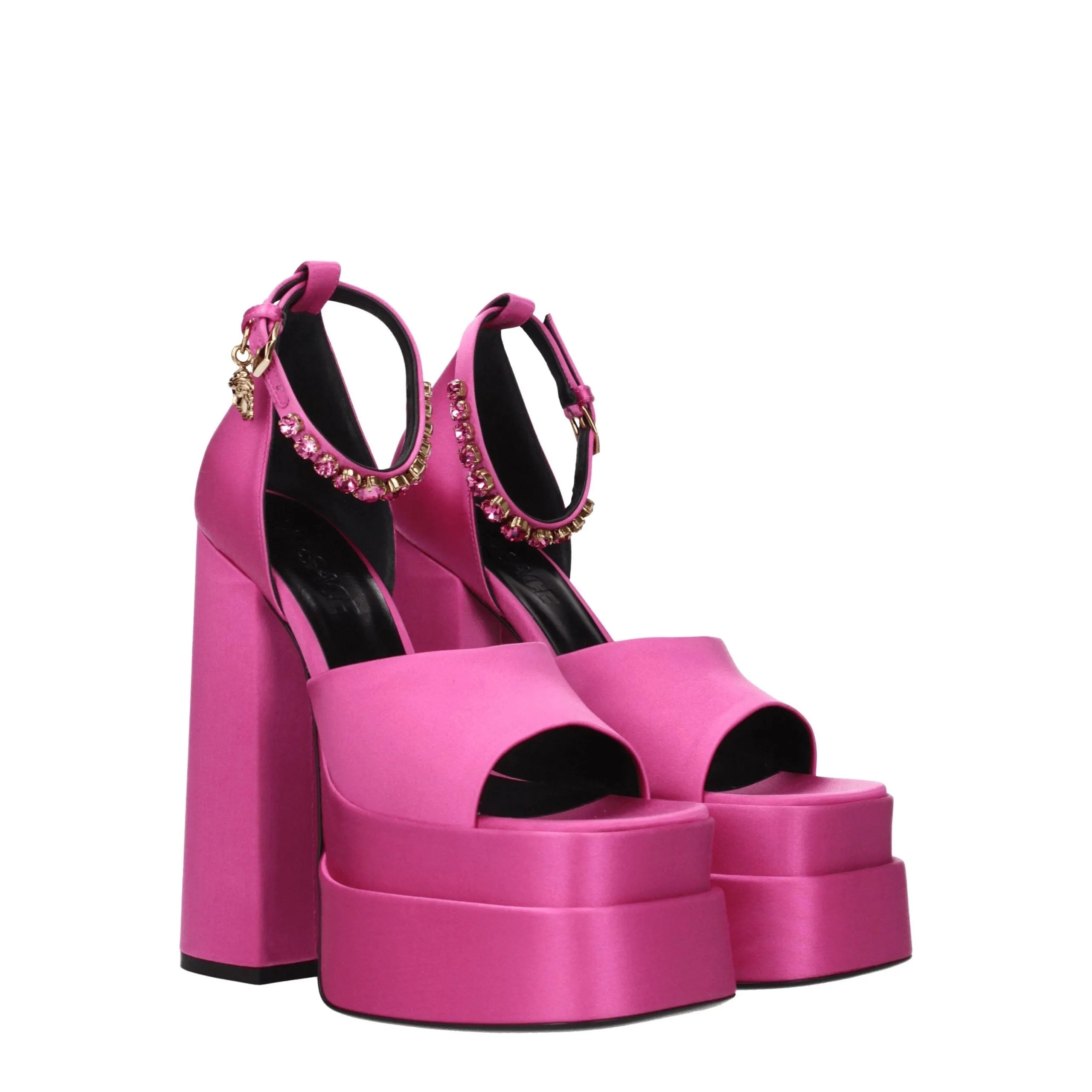Fuchsia satin Versace platform sandals with block heels, open toes, and rhinestone ankle straps.