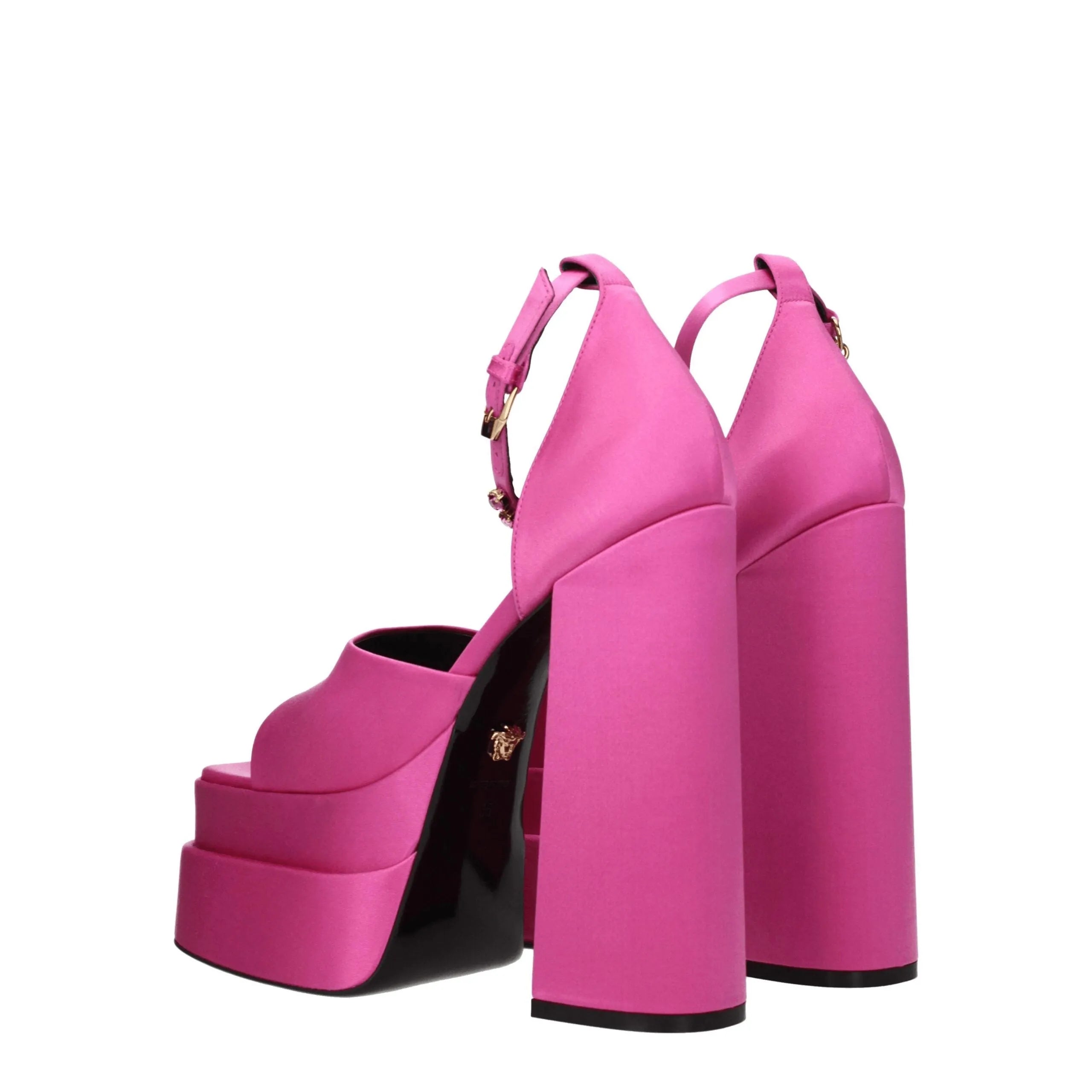 Versace fuchsia satin platform sandals with high block heels, ankle buckle straps, and a gold Medusa logo.
