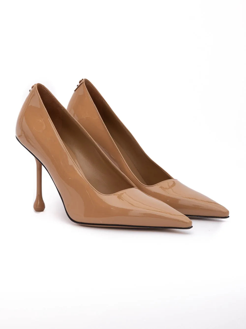 Elegant Jimmy Choo Ixia 95 biscuit patent leather pumps with sharp pointed toes and slender 95mm stiletto heels.