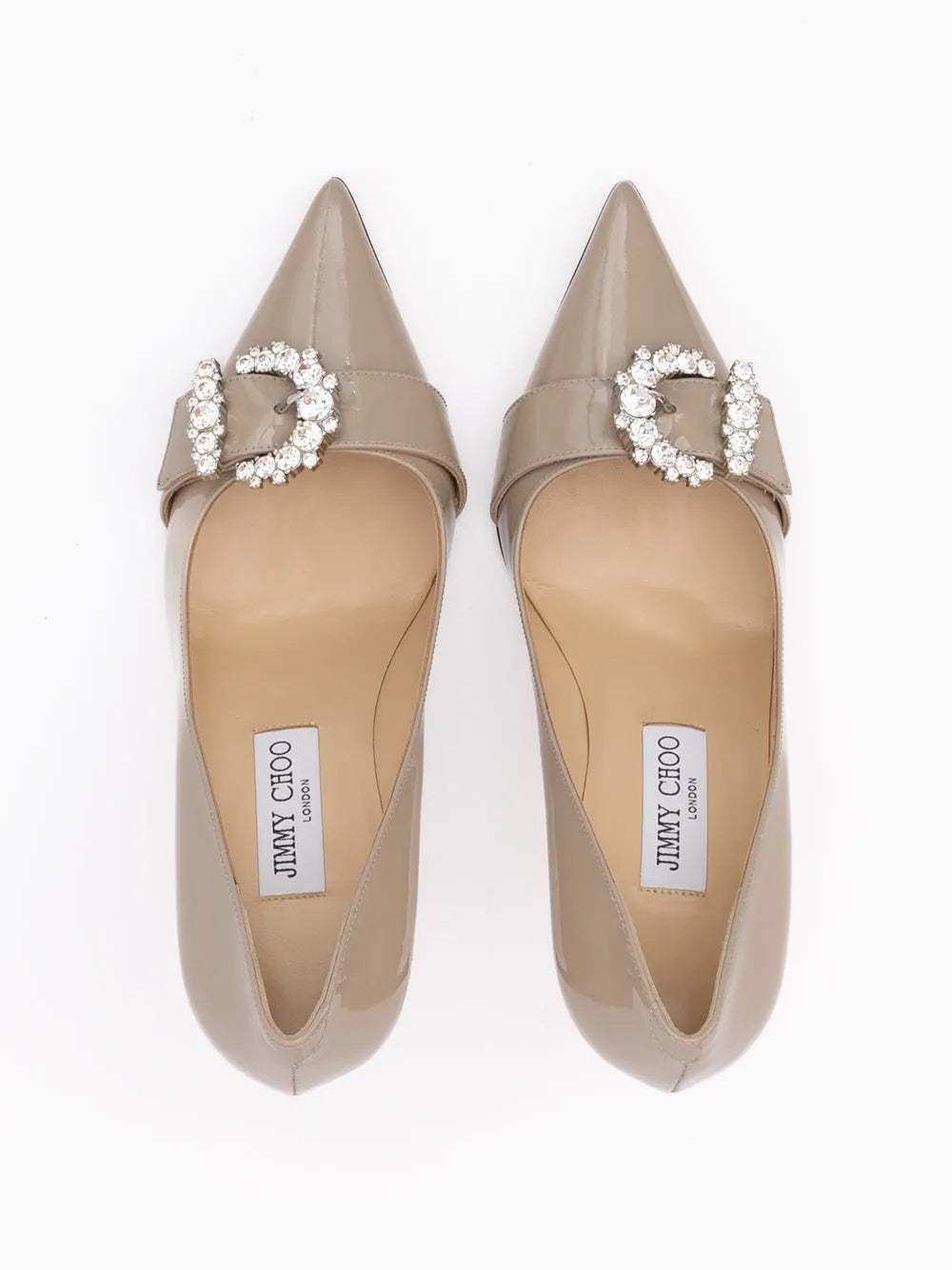 Jimmy Choo Taupe Grey Patent Leather Chery 85 pumps with pointed toes and crystal buckles.