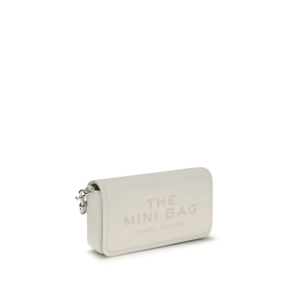 White grained calf leather Marc Jacobs Mini Bag shoulder bag with flap closure, debossed logo, and silver chain detail.