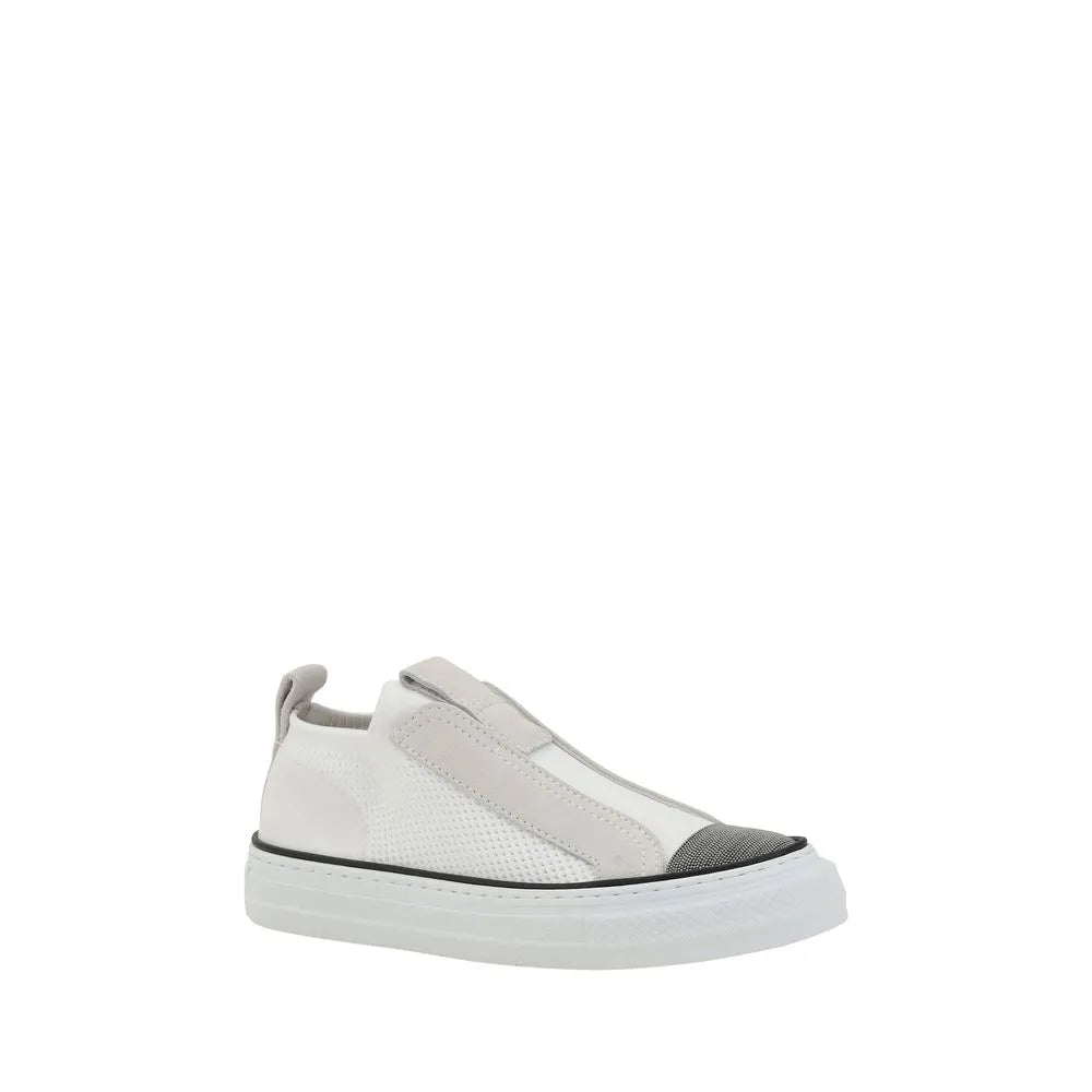 White nylon low-top slip-on sneakers with perforated mesh, light grey suede accents, and a dark toe cap.