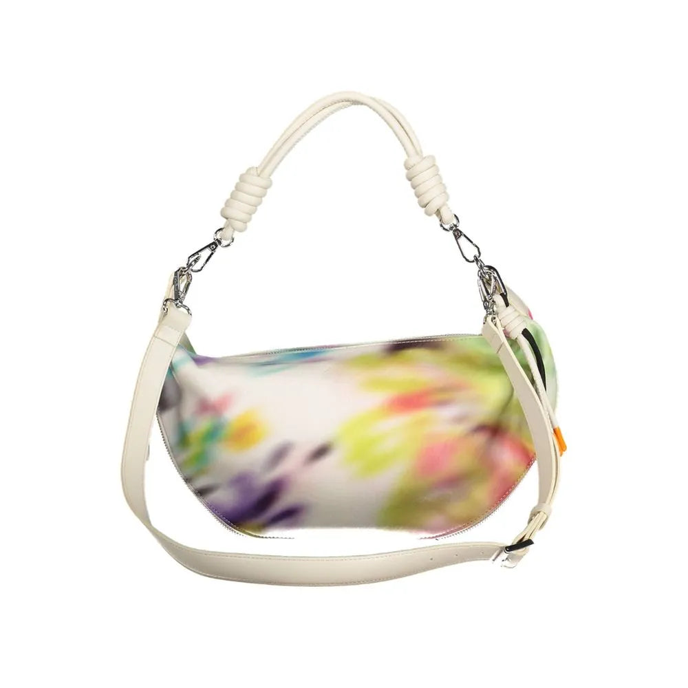 White polyurethane women's crescent handbag with vibrant multi-color abstract print, knotted handle, and adjustable strap.